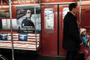 NEW YORK, NY - NOVEMBER 24: A New York City subway car is covered in Nazi imagery to promote the new Amazon television series "The Man in the High Castle" on November 24, 2015 in New York City. Amazon has decided to pull the ads, which were placed on the 42nd Street Shuttle, which runs between Times Square and the transit hub Grand Central Terminal. The ads were pulled following an outcry from passengers and social media users. (Photo by Spencer Platt/Getty Images)